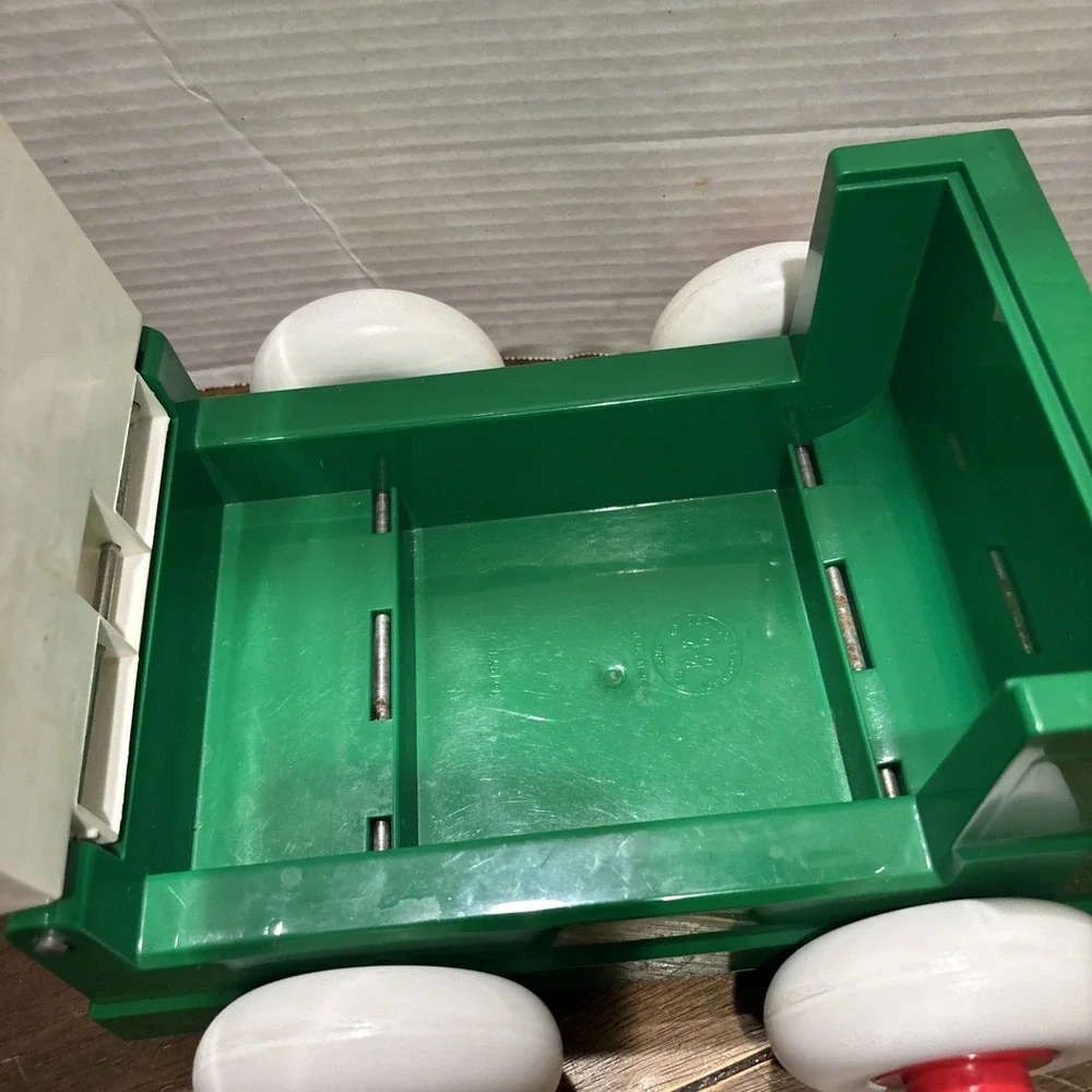 Vintage Johnson & Johnson Green Truck Toy Stack & Dump with Shapes USA 1983‎